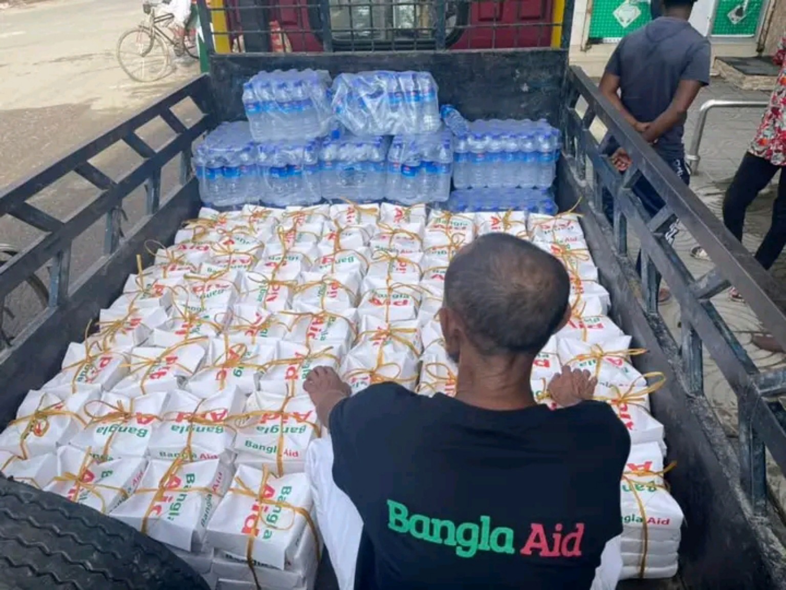 Volunteer helping prepare relief packages